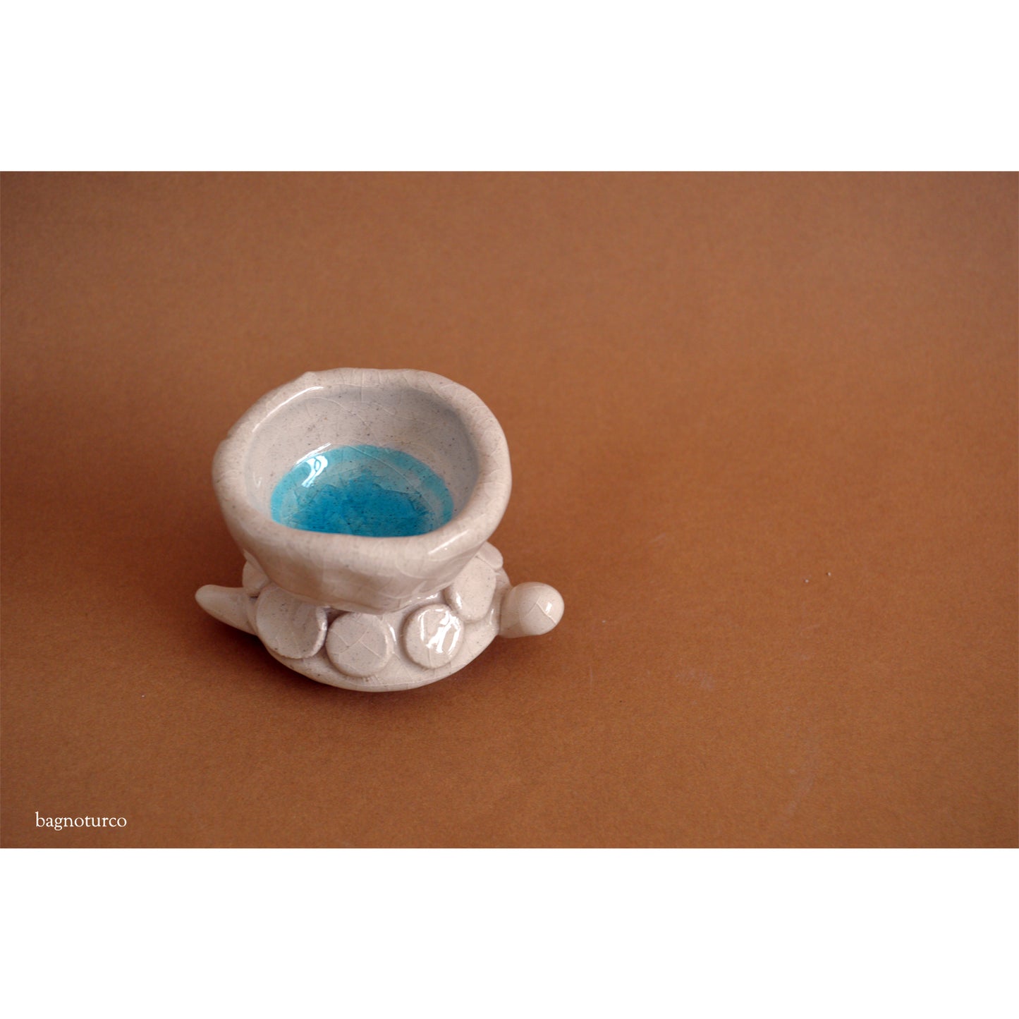 Ceramic turtle-shaped sculpture